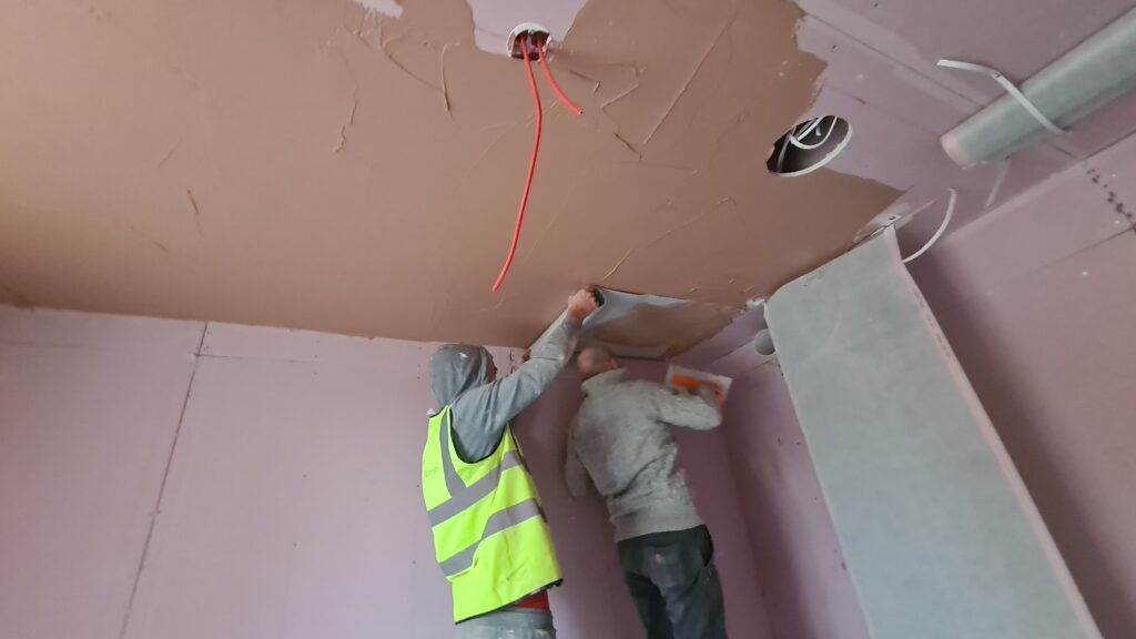 infrared mats being plastered in
