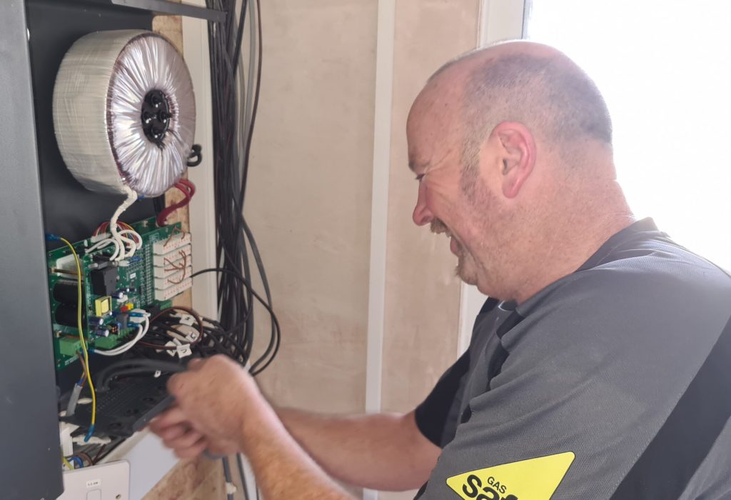 electrician installing a 36v transformer